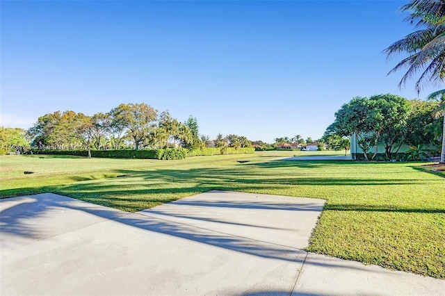 15595 Chandelle Pl, Wellington, FL 33414 - view of community featuring a yard and a patio area
