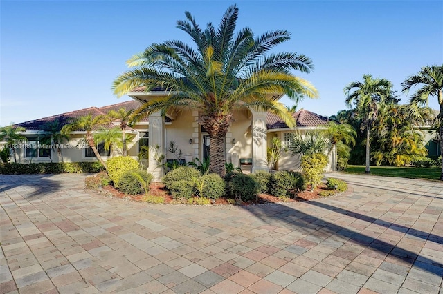 15595 Chandelle Pl, Wellington, FL 33414 - mediterranean / spanish home with stucco siding and driveway