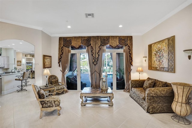 15595 Chandelle Pl, Wellington, FL 33414 - living area with crown molding, arched walkways, light tile patterned flooring, french doors, and recessed lighting