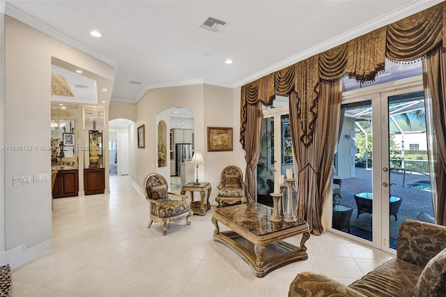 15595 Chandelle Pl, Wellington, FL 33414 - living room featuring french doors, arched walkways, crown molding, light tile patterned flooring, and recessed lighting