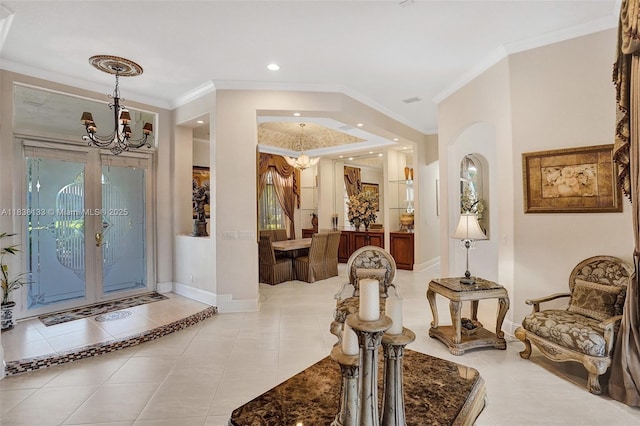 15595 Chandelle Pl, Wellington, FL 33414 - foyer with a chandelier, ornamental molding, tile patterned floors, recessed lighting, and french doors