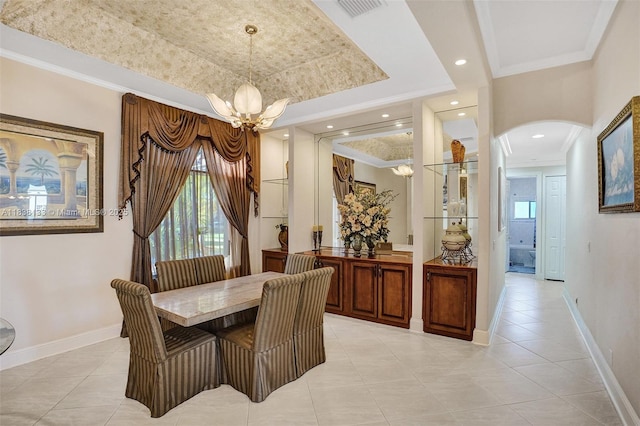 15595 Chandelle Pl, Wellington, FL 33414 - dining room featuring a chandelier, arched walkways, a tray ceiling, ornamental molding, and light tile patterned flooring