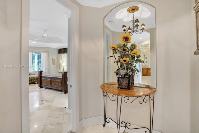 15595 Chandelle Pl, Wellington, FL 33414 - hall featuring a chandelier, ornamental molding, and arched walkways