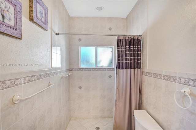 15595 Chandelle Pl, Wellington, FL 33414 - bathroom with tile walls, tiled shower, and a wainscoted wall