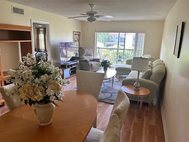 371 S Hollybrook Dr Unit 308, Pembroke Pines, FL 33025 - living room featuring wood finished floors, a textured ceiling, and ceiling fan