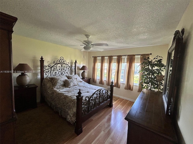371 S Hollybrook Dr Unit 308, Pembroke Pines, FL 33025 - bedroom featuring wood finished floors, a textured ceiling, and a ceiling fan