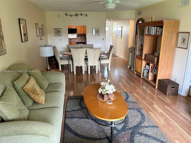 371 S Hollybrook Dr Unit 308, Pembroke Pines, FL 33025 - living area featuring ceiling fan and wood finished floors