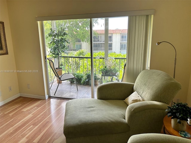 371 S Hollybrook Dr Unit 308, Pembroke Pines, FL 33025 - living area with light wood-style flooring and baseboards