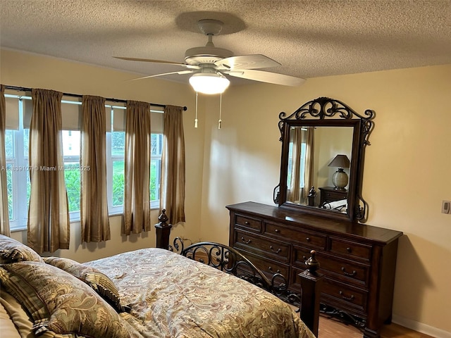 371 S Hollybrook Dr Unit 308, Pembroke Pines, FL 33025 - bedroom with a textured ceiling and a ceiling fan