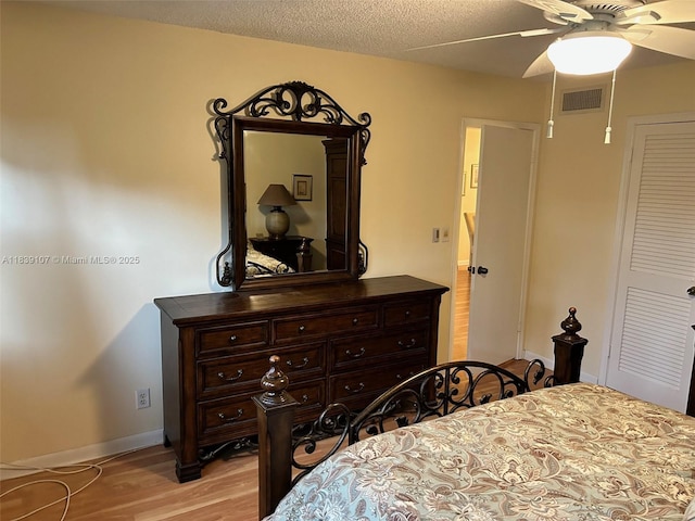 371 S Hollybrook Dr Unit 308, Pembroke Pines, FL 33025 - bedroom featuring light wood-type flooring, a ceiling fan, and a textured ceiling