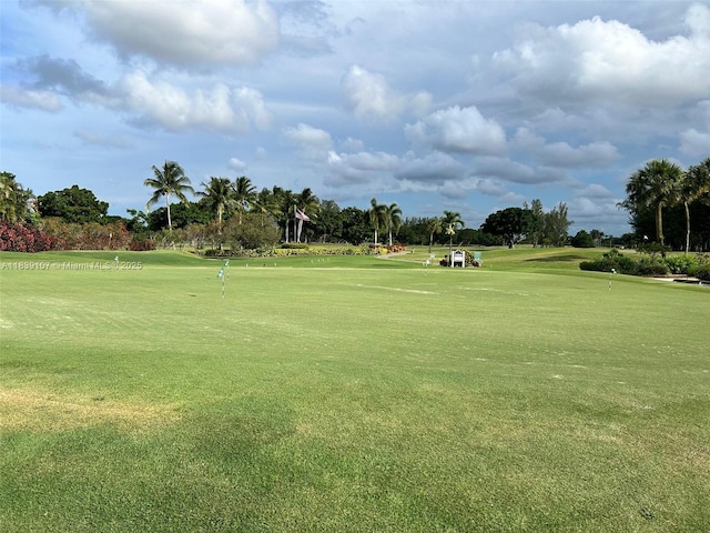 371 S Hollybrook Dr Unit 308, Pembroke Pines, FL 33025 - view of community with golf course view, a putting green, and view of wooded area