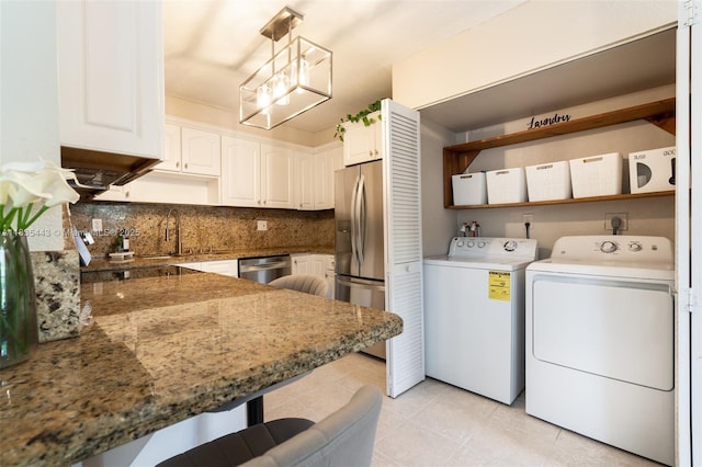 8010 SW 18th Ct Unit 1-8, Davie, FL 33324 - laundry room with washer and clothes dryer, a chandelier, and light tile patterned floors