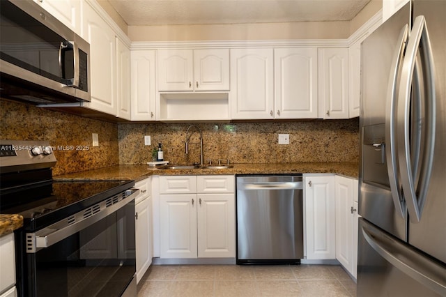 8010 SW 18th Ct Unit 1-8, Davie, FL 33324 - kitchen featuring stainless steel appliances, white cabinets, and dark stone counters