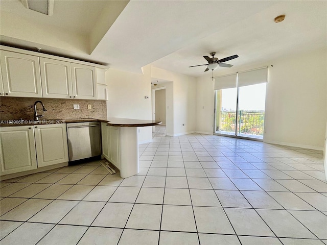 3500 Coral Way Unit 913, Miami, FL 33145 - kitchen with stainless steel dishwasher, open floor plan, dark countertops, tasteful backsplash, and a peninsula