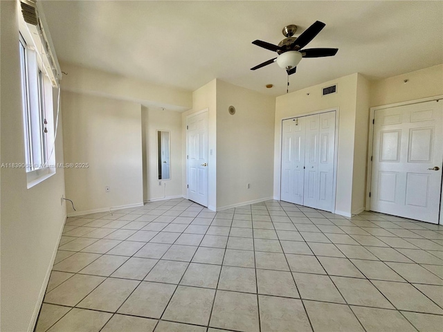 3500 Coral Way Unit 913, Miami, FL 33145 - unfurnished bedroom featuring light tile patterned floors, a closet, and ceiling fan