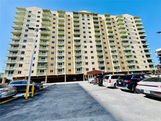3500 Coral Way Unit 913, Miami, FL 33145 - view of apartment building / complex featuring uncovered parking