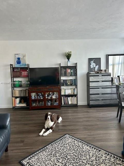 2899 Collins Ave Unit 1504, Miami Beach, FL 33140 - living room featuring baseboards and wood finished floors