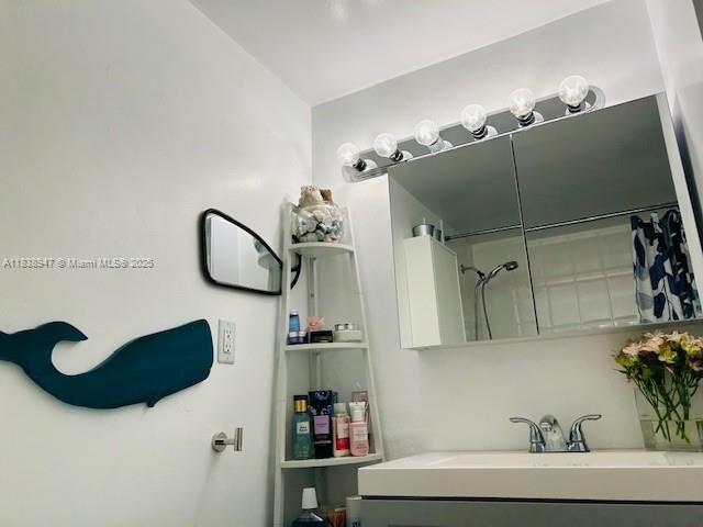 2899 Collins Ave Unit 1504, Miami Beach, FL 33140 - full bath featuring vanity and a shower with curtain
