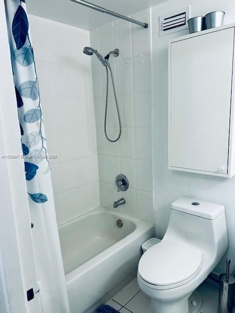 2899 Collins Ave Unit 1504, Miami Beach, FL 33140 - full bath featuring shower / bathtub combination with curtain and tile patterned flooring