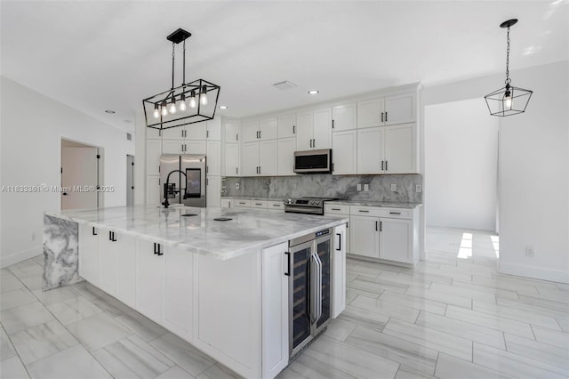5050 Greenwich Preserve Ct, Boynton Beach, FL 33436 - kitchen with wine cooler, appliances with stainless steel finishes, white cabinets, and recessed lighting