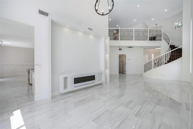 5050 Greenwich Preserve Ct, Boynton Beach, FL 33436 - unfurnished living room featuring stairs, a fireplace, a high ceiling, and recessed lighting