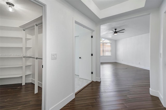 5050 Greenwich Preserve Ct, Boynton Beach, FL 33436 - corridor with dark wood-type flooring and built in shelves