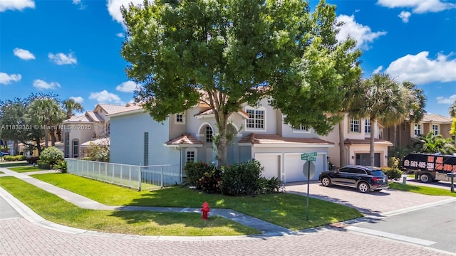 5050 Greenwich Preserve Ct, Boynton Beach, FL 33436 - view of front of home with an attached garage, driveway, a residential view, and stucco siding