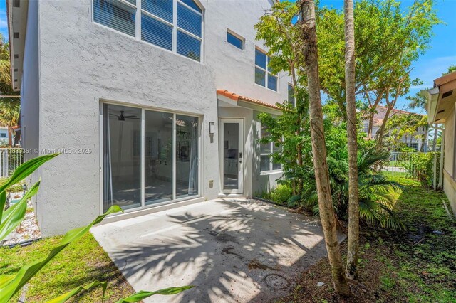 5050 Greenwich Preserve Ct, Boynton Beach, FL 33436 - back of property with stucco siding and a patio