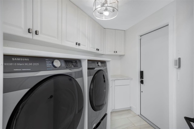 5050 Greenwich Preserve Ct, Boynton Beach, FL 33436 - washroom with independent washer and dryer, cabinet space, a chandelier, and light marble finish floors