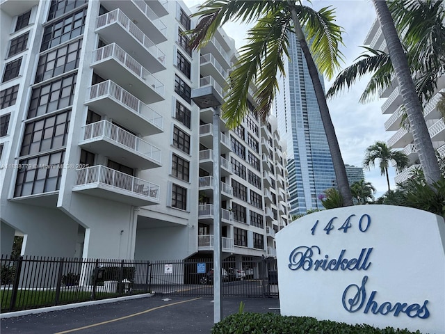 1440 Brickell Bay Dr Unit 307, Miami, FL 33131 - view of apartment building / complex featuring uncovered parking