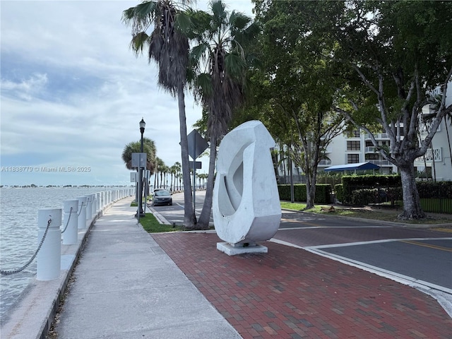 1440 Brickell Bay Dr Unit 307, Miami, FL 33131 - view of property's community with uncovered parking and a water view