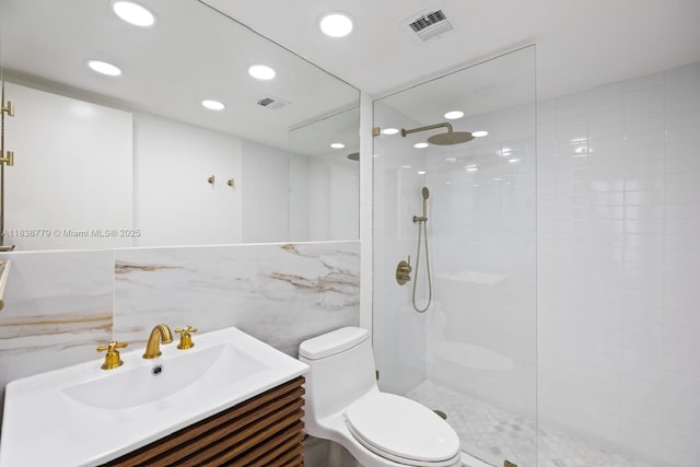 1440 Brickell Bay Dr Unit 307, Miami, FL 33131 - full bath featuring vanity, walk in shower, tile walls, and recessed lighting