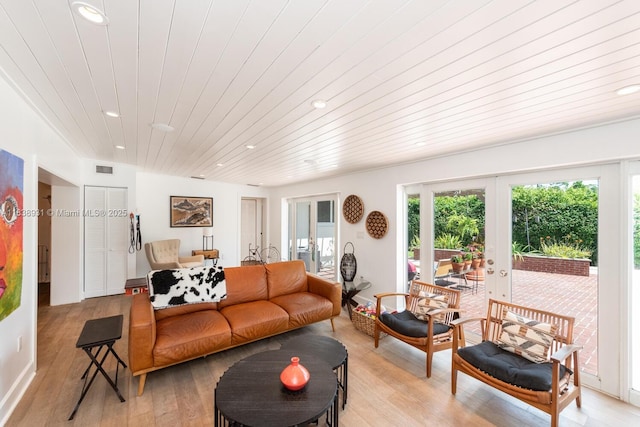 6957 SW 148th Ter, Palmetto Bay, FL 33158 - living room featuring french doors, wood ceiling, light wood-style floors, and recessed lighting