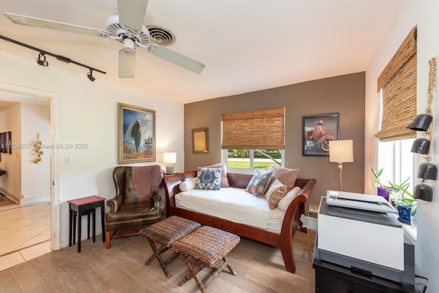 6957 SW 148th Ter, Palmetto Bay, FL 33158 - bedroom featuring ceiling fan, wood finished floors, and rail lighting