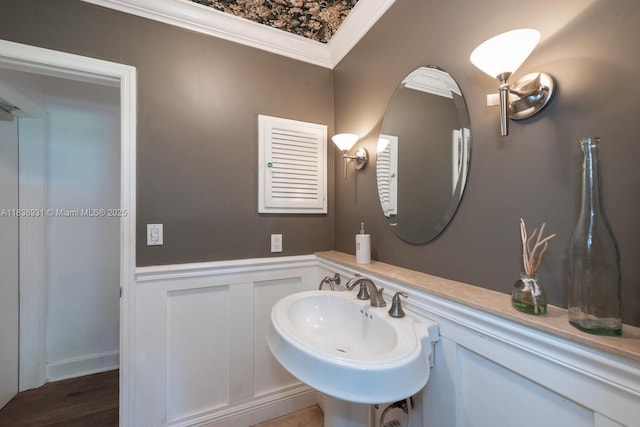 6957 SW 148th Ter, Palmetto Bay, FL 33158 - bathroom with a decorative wall, crown molding, and wainscoting