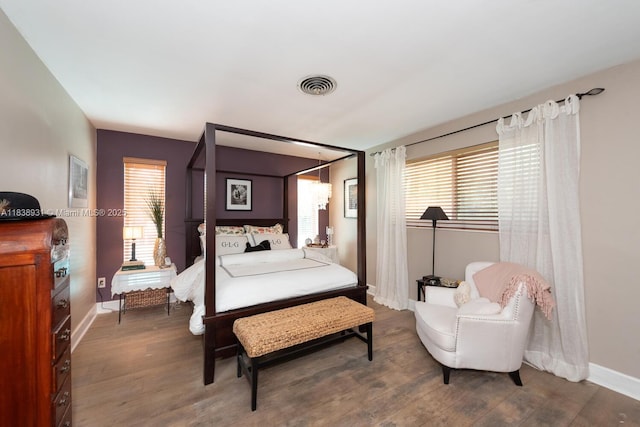 6957 SW 148th Ter, Palmetto Bay, FL 33158 - bedroom with wood finished floors and multiple windows