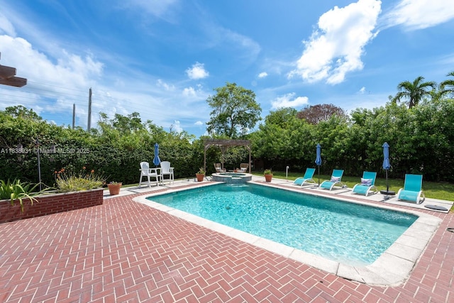 6957 SW 148th Ter, Palmetto Bay, FL 33158 - view of pool featuring a pool with connected hot tub, a patio, a pergola, and view of scattered trees