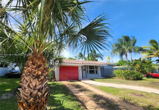 2451 SW 16th St, Fort Lauderdale, FL 33312 - ranch-style home featuring an attached garage, driveway, and stucco siding