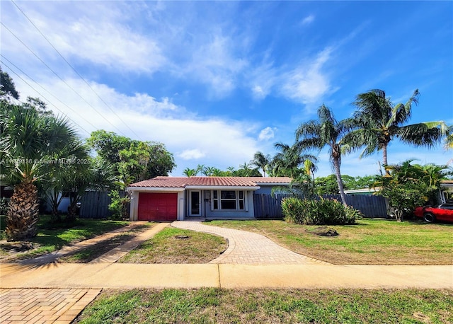 2451 SW 16th St, Fort Lauderdale, FL 33312 - ranch-style home featuring driveway, a garage, and a tile roof