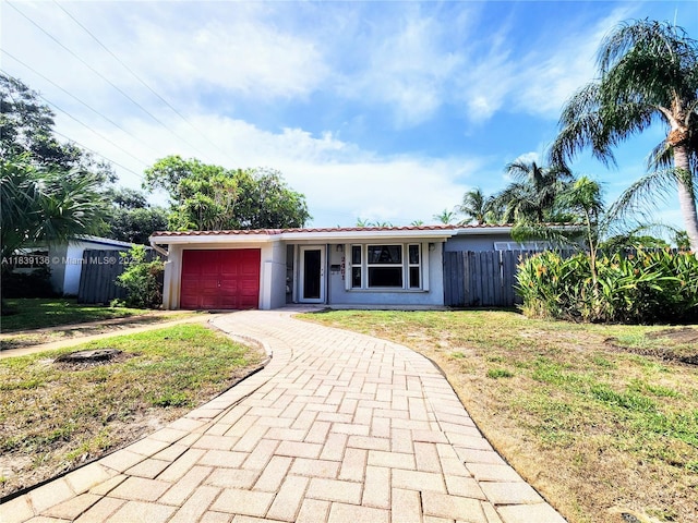 2451 SW 16th St, Fort Lauderdale, FL 33312 - single story home featuring decorative driveway, an attached garage, and stucco siding