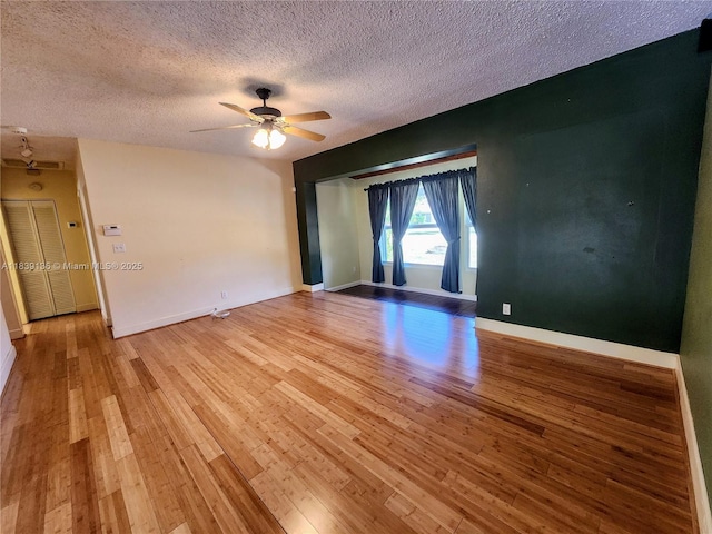 2451 SW 16th St, Fort Lauderdale, FL 33312 - unfurnished room with light wood-style floors, a textured ceiling, and a ceiling fan