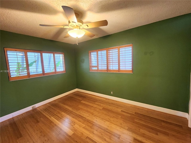 2451 SW 16th St, Fort Lauderdale, FL 33312 - unfurnished room with wood finished floors, ceiling fan, and a textured ceiling