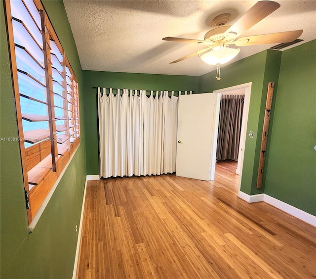 2451 SW 16th St, Fort Lauderdale, FL 33312 - unfurnished room with a ceiling fan, wood finished floors, and a textured ceiling