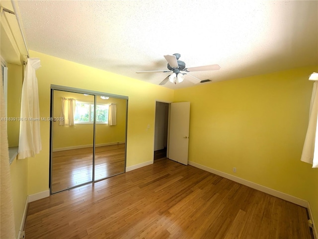 2451 SW 16th St, Fort Lauderdale, FL 33312 - unfurnished bedroom featuring wood finished floors, a closet, and a ceiling fan