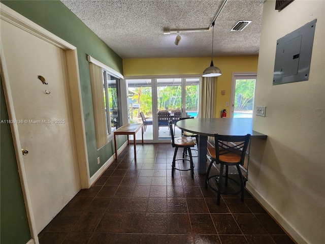 2451 SW 16th St, Fort Lauderdale, FL 33312 - dining area featuring electric panel, a textured ceiling, and track lighting