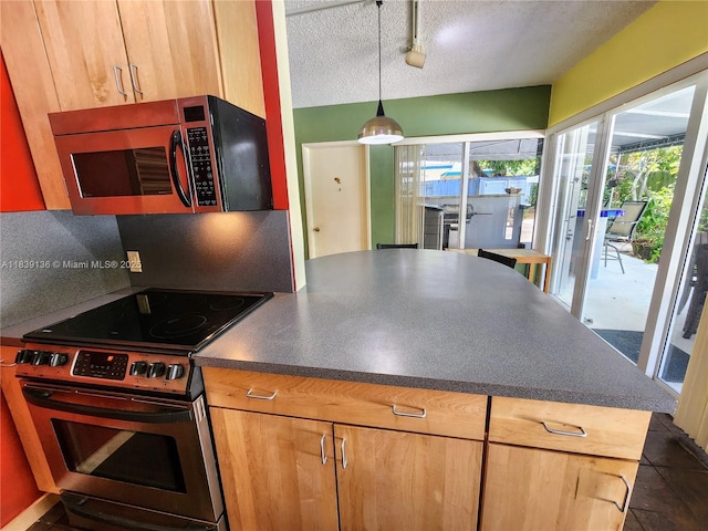 2451 SW 16th St, Fort Lauderdale, FL 33312 - kitchen with stainless steel appliances, dark countertops, a textured ceiling, track lighting, and decorative light fixtures