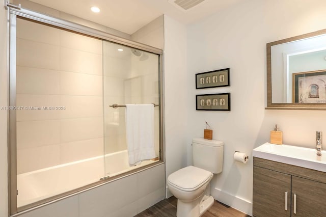 2900 NE 7th Ave Unit 404, Miami, FL 33137 - full bath featuring vanity, combined bath / shower with glass door, wood finished floors, and recessed lighting