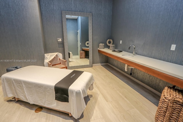 2900 NE 7th Ave Unit 404, Miami, FL 33137 - bedroom featuring wood finished floors and wallpapered walls