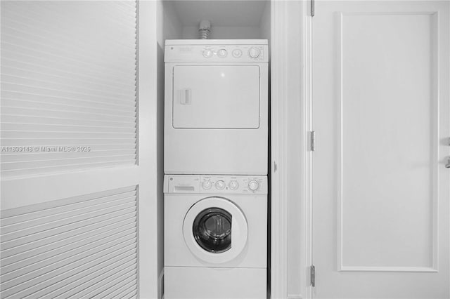 4401 Collins Ave Unit 2305, Miami Beach, FL 33140 - laundry area with stacked washer and clothes dryer