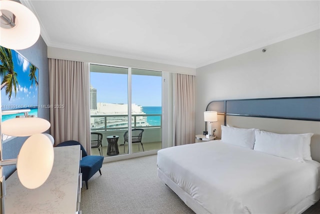 4401 Collins Ave Unit 2305, Miami Beach, FL 33140 - bedroom featuring crown molding, access to outside, carpet, and a water view